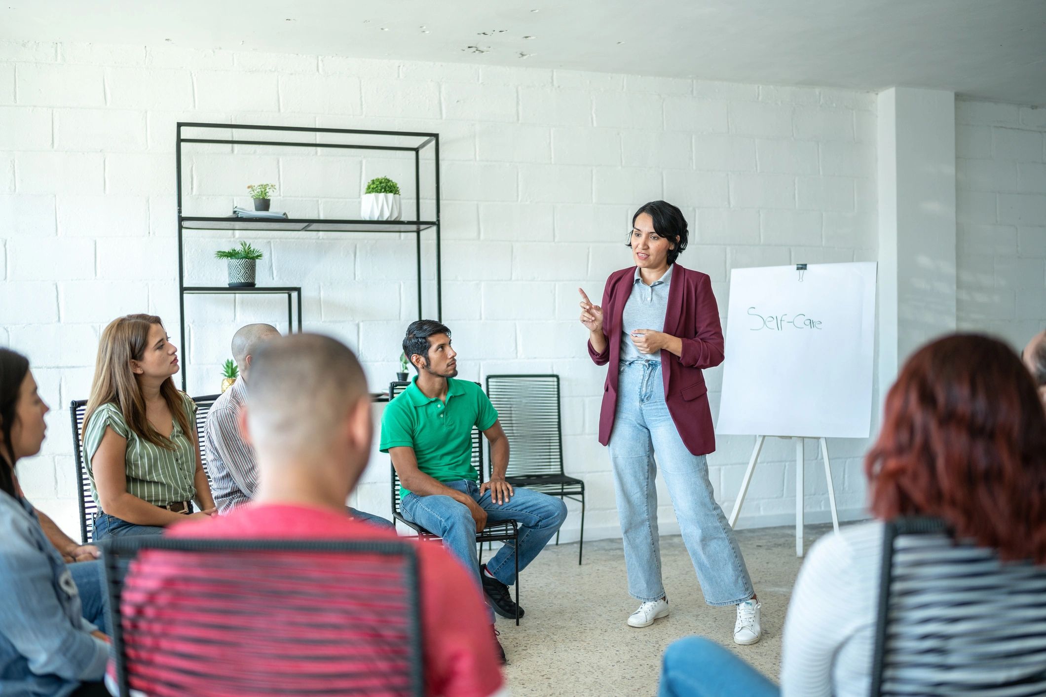 Facilitator presenting to colleagues during a Lean training workshop