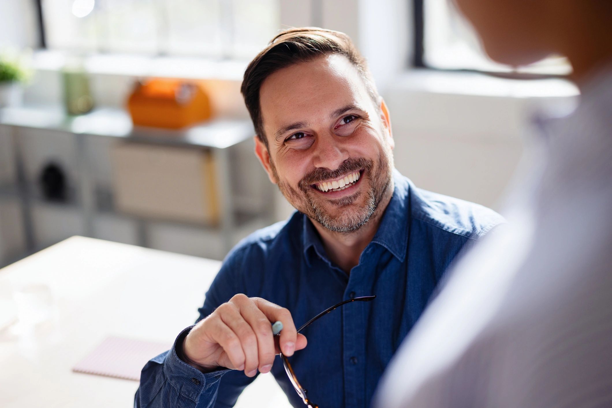 Business leaders in a collaborative coaching conversation